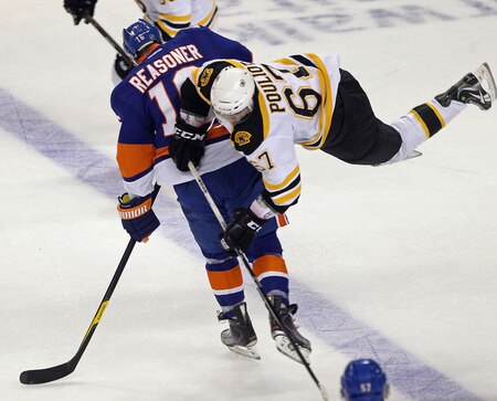 BRIDGEPORT, CT - OCTOBER 01:  Marty Reasoner #16 of the New York Islanders steps into Benoit Pouliot #67 of the Boston Bruins at the Webster Bank Arena on October 1, 2011 in Bridgeport, Connecticut.  <br /><br /><span class="help">(Photo by Bruce Bennett/Getty Images)</span>