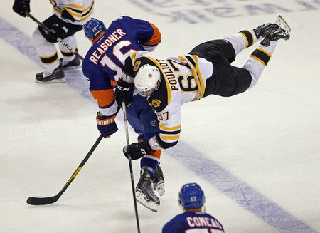 BRIDGEPORT, CT - OCTOBER 01:  Marty Reasoner #16 of the New York Islanders steps into Benoit Pouliot #67 of the Boston Bruins at the Webster Bank Arena on October 1, 2011 in Bridgeport, Connecticut.  <br /><br /><span class="help">(Photo by Bruce Bennett/Getty Images)</span>
