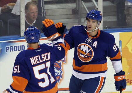 BRIDGEPORT, CT - OCTOBER 01: John Tavares #91 of the New York Islanders scores a first period goal against the Boston Bruins and is greeted by Frans Nielsen #51 in their game against the Boston Bruins at the Webster Bank Arena on October 1, 2011 in Bridgeport, Connecticut.  <br /><br /><span class="help">(Photo by Bruce Bennett/Getty Images)</span>