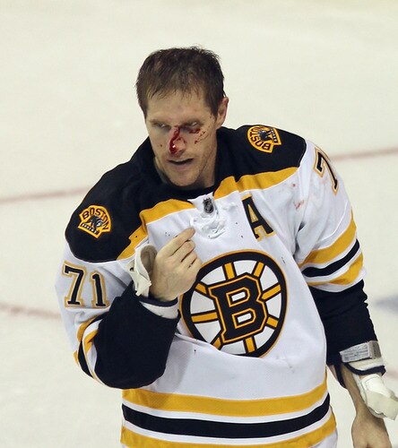 BRIDGEPORT, CT - OCTOBER 01:  Chris Clark #71 of the Boston Bruins leaves the ice following a fight with Michael Haley #18 of the New York Islanders at the Webster Bank Arena on October 1, 2011 in Bridgeport, Connecticut.  <br /><br /><span class="help">(Photo by Bruce Bennett/Getty Images)</span>