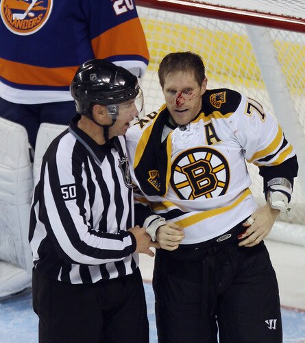 BRIDGEPORT, CT - OCTOBER 01:  Chris Clark #71 of the Boston Bruins leaves the ice following a fight with Michael Haley #18 of the New York Islanders at the Webster Bank Arena on October 1, 2011 in Bridgeport, Connecticut.  <br /><br /><span class="help">(Photo by Bruce Bennett/Getty Images)</span>