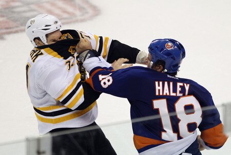 BRIDGEPORT, CT - OCTOBER 01:  Chris Clark #71 of the Boston Bruins fights with Michael Haley #18 of the New York Islanders at the Webster Bank Arena on October 1, 2011 in Bridgeport, Connecticut.  <br /><br /><span class="help">(Photo by Bruce Bennett/Getty Images)</span>
