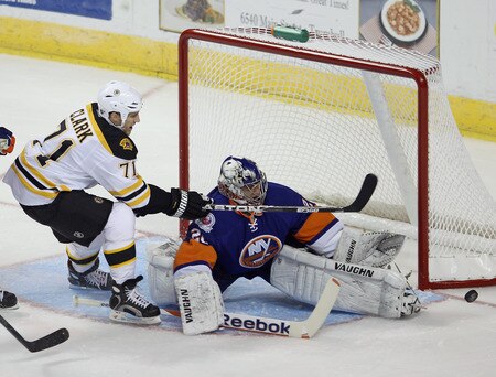 BRIDGEPORT, CT - OCTOBER 01:  Chris Clark #71 of the Boston Bruins is stopped by goaltender Evgeni Nabokov #20 of the New York Islanders at the Webster Bank Arena on October 1, 2011 in Bridgeport, Connecticut.  <br /><br /><span class="help">(Photo by Bruce Bennett/Getty Images)</span>