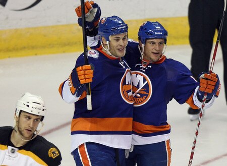 BRIDGEPORT, CT - OCTOBER 01: Marty Reasoner #16 (L) of the New York Islanders scores at 6:48 of the second period against the Boston Bruins and is joined by Michael Haley #18 (R) at the Webster Bank Arena on October 1, 2011 in Bridgeport, Connecticut.  <br /><br /><span class="help">(Photo by Bruce Bennett/Getty Images)</span>
