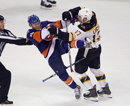 BRIDGEPORT, CT - OCTOBER 01:  P.A. Parenteau #15 of the New York Islanders is hit by Milan Lucic #17 of the Boston Bruins at the Webster Bank Arena on October 1, 2011 in Bridgeport, Connecticut. The Bruins defeated the Islanders 3-2.  <br /><br /><span class="help">(Photo by Bruce Bennett/Getty Images)</span>