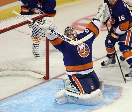 BRIDGEPORT, CT - OCTOBER 01:  Evgeni Nabokov #20 of the New York Islanders makes a third period save against the Boston Bruins at the Webster Bank Arena on October 1, 2011 in Bridgeport, Connecticut. The Bruins defeated the Islanders 3-2.  <br /><br /><span class="help">(Photo by Bruce Bennett/Getty Images)</span>