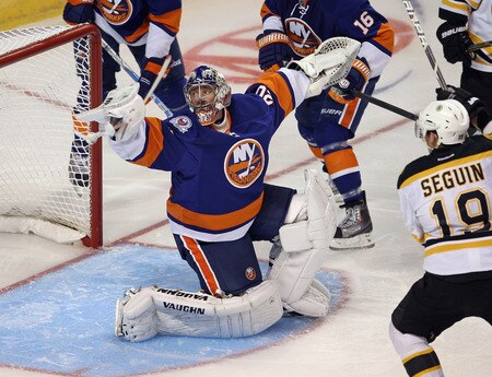 BRIDGEPORT, CT - OCTOBER 01:  Evgeni Nabokov #20 of the New York Islanders makes a third period save against the Boston Bruins at the Webster Bank Arena on October 1, 2011 in Bridgeport, Connecticut. The Bruins defeated the Islanders 3-2.  <br /><br /><span class="help">(Photo by Bruce Bennett/Getty Images)</span>