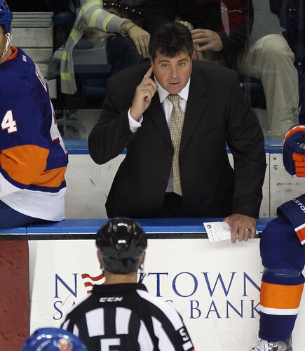 BRIDGEPORT, CT - OCTOBER 01: New York Islander coach Jack Capuano speaks with referee Chris Rooney #5 in the game against the Boston Bruins at the Webster Bank Arena on October 1, 2011 in Bridgeport, Connecticut. The Bruins defeated the Islanders 3-2. <br /><br /><span class="help">(Photo by Bruce Bennett/Getty Images)</span>