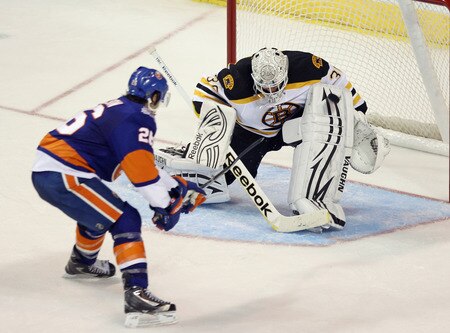 BRIDGEPORT, CT - OCTOBER 01: Matt Moulson #26 of the New York Islanders is stopped in the closing minutes of the game by Tim Thomas #30 of the Boston Bruins at the Webster Bank Arena on October 1, 2011 in Bridgeport, Connecticut. The Bruins defeated the Islanders 3-2. <br /><br /><span class="help">(Photo by Bruce Bennett/Getty Images)</span>