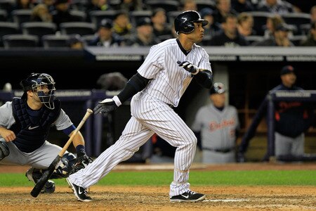 NEW YORK, NY - OCTOBER 01:  Robinson Cano #24 of the New York Yankees hits an RBI double in the eighth inning scoring Derek Jeter #2 during Game One of the American League Division Series against the Tampa Bay Rays at Yankee Stadium on October 1, 2011 in New York City.  <br /><br /><span class="help">(Photo by Chris Trotman/Getty Images)</span>