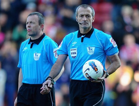 STOKE ON TRENT, ENGLAND - OCTOBER 15: Referee Martin Atkinson walks out with his assistants during the Barclays Premier League match between Stoke City and Fulham at Britannia Stadium on October 15, 2011 in Stoke on Trent, England.  <br /><br /><span class="help">(Photo by Laurence Griffiths/Getty Images)</span>
