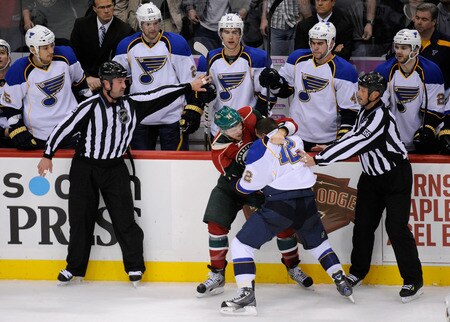 ST PAUL, MN - NOVEMBER 5: Darroll Powe #14 of the Minnesota Wild gets tangled up with Scott Nichol #12 of the St. Louis Blues in the second period on November 5, 2011 at Xcel Energy Center in Minneapolis, Minnesota. The Wild defeated the Blues 2-1. <br /><br /><span class="help">(Photo by Hannah Foslien/Getty Images)</span>