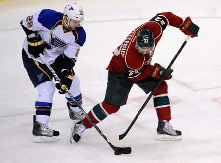 ST PAUL, MN - NOVEMBER 5: Carlo Colaiacovo #28 of the St. Louis Blues takes the puck away from Cal Clutterbuck #22 of the Minnesota Wild in the second period on November 5, 2011 at Xcel Energy Center in Minneapolis, Minnesota. The Wild defeated the Blues 2-1. <br /><br /><span class="help">(Photo by Hannah Foslien/Getty Images)</span>