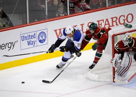 ST PAUL, MN - NOVEMBER 5: Josh Harding #37 of the Minnesota Wild looks on as Marco Scandella #6 of the Minnesota Wild and Ryan Reaves #75 of the St. Louis Blues scramble for the puck in the second period on November 5, 2011 at Xcel Energy Center in Minneapolis, Minnesota. The Wild defeated the Blues 2-1. <br /><br /><span class="help">(Photo by Hannah Foslien/Getty Images)</span>