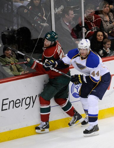 ST PAUL, MN - NOVEMBER 5: Jason Arnott #44 of the St. Louis Blues checks Nick Schultz #55 of the Minnesota Wild into the boards in the second period on November 5, 2011 at Xcel Energy Center in Minneapolis, Minnesota. The Wild defeated the Blues 2-1. <br /><br /><span class="help">(Photo by Hannah Foslien/Getty Images)</span>