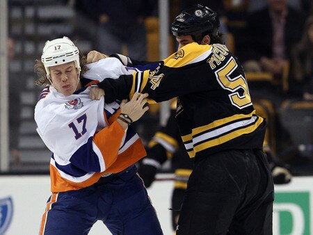 BOSTON, MA - NOVEMBER 07:  Adam McQuaid #54 of the Boston Bruins and Matt Martin #17 of the New York Islanders fight in the first period on November 7, 2011 at TD Garden in Boston, Massachusetts.  <br /><br /><span class="help">(Photo by Elsa/Getty Images)</span>