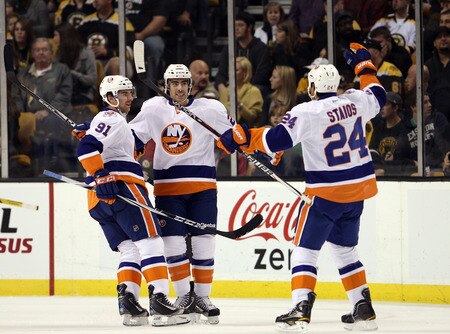 BOSTON, MA - NOVEMBER 07:  John Tavares #91,Matt Moulson #26 and Steve Staios #24 of the New York Islanders celebrates a goal in the first period against the Boston Bruins on November 7, 2011 at TD Garden in Boston, Massachusetts.  <br /><br /><span class="help">(Photo by Elsa/Getty Images)</span>