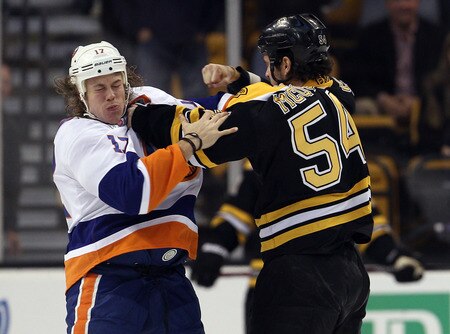 BOSTON, MA - NOVEMBER 07:  Adam McQuaid #54 of the Boston Bruins and Matt Martin #17 of the New York Islanders fight in the first period on November 7, 2011 at TD Garden in Boston, Massachusetts.  <br /><br /><span class="help">(Photo by Elsa/Getty Images)</span>