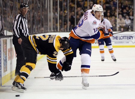 BOSTON, MA - NOVEMBER 07: Josh Bailey #12 of the New York Islanders and Shawn Thornton #22 of the Boston Bruins collide in the second period on November 7, 2011 at TD Garden in Boston, Massachusetts.  <br /><br /><span class="help">(Photo by Elsa/Getty Images)</span>