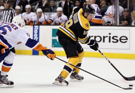 BOSTON, MA - NOVEMBER 07:  Tyler Seguin #19 of the Boston Bruins takes the puck as Marty Reasoner #16 of the New York Islanders defends on November 7, 2011 at TD Garden in Boston, Massachusetts. The Boston Bruins defeated the New York Islanders 6-2.  <br /><br /><span class="help">(Photo by Elsa/Getty Images)</span>