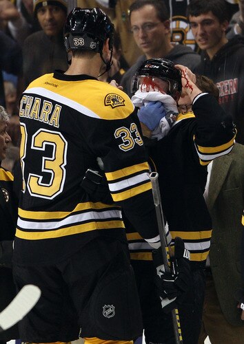 BOSTON, MA - NOVEMBER 07:  Daniel Paille #20 of the Boston Bruins is taken off the ice after getting hit in the third period against the New York Islanders on November 7, 2011 at TD Garden in Boston, Massachusetts. The Boston Bruins defeated the New York Islanders 6-2.  <br /><br /><span class="help">(Photo by Elsa/Getty Images)</span>