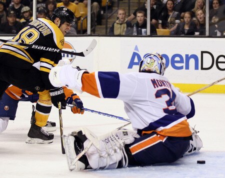 BOSTON, MA - NOVEMBER 07:  Nathan Horton #18 of the Boston Bruins gets the puck past Al Montoya #35 of the New York Islanders in the third period on November 7, 2011 at TD Garden in Boston, Massachusetts. The Boston Bruins defeated the New York Islanders 6-2.  <br /><br /><span class="help">(Photo by Elsa/Getty Images)</span>