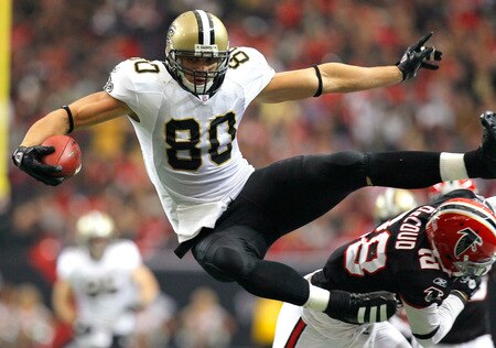 ATLANTA, GA - NOVEMBER 13:  Jimmy Graham #80 of the New Orleans Saints hurdles over Thomas DeCoud #28 of the Atlanta Falcons at Georgia Dome on November 13, 2011 in Atlanta, Georgia.  <br /><br /><span class="help">(Photo by Kevin C. Cox/Getty Images)</span>