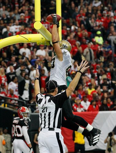 ATLANTA, GA - NOVEMBER 13:  Jimmy Graham #80 of the New Orleans Saints dunks the ball between the goalpost after scoring a touchdown against the Atlanta Falcons at Georgia Dome on November 13, 2011 in Atlanta, Georgia.  <br /><br /><span class="help">(Photo by Kevin C. Cox/Getty Images)</span>