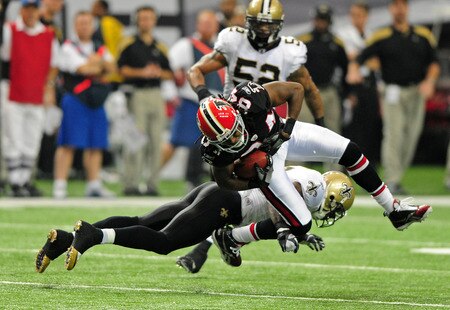 ATLANTA, GA - NOVEMBER 13: Roddy White #84 of the Atlanta Falcons is upended by Malcolm Jenkins #27 of the New Orleans Saints at the Georgia Dome on November 13, 2011 in Atlanta, Georgia. <br /><br /><span class="help">(Photo by Scott Cunningham/Getty Images)</span>