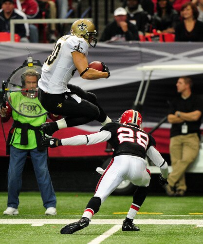 ATLANTA, GA - NOVEMBER 13: Jimmy Graham #80 of the New Orleans Saints leaps over Thomas DeCoud #28 of the Atlanta Falcons at the Georgia Dome on November 13, 2011 in Atlanta, Georgia. <br /><br /><span class="help">(Photo by Scott Cunningham/Getty Images)</span>