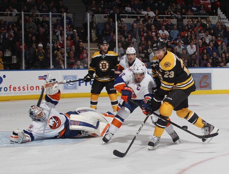 UNIONDALE, NY - NOVEMBER 19: Rick DiPietro #39 and Mark Streit #2 of the New York Islanders defend the net against Chris Kelly #23 of the Boston Bruins at the Nassau Veterans Memorial Coliseum on November 19, 2011 in Uniondale, New York.  <br /><br /><span class="help">(Photo by Bruce Bennett/Getty Images)</span>