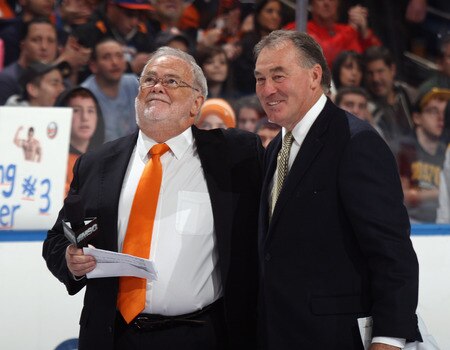 UNIONDALE, NY - NOVEMBER 19: (L-R) Jiggs McDonald and Ed Westfall watch a banner raising in honor of Ed Westfall prior to the game between the New York Islanders and the Boston Bruins at the Nassau Veterans Memorial Coliseum on November 19, 2011 in Uniondale, New York.  <br /><br /><span class="help">(Photo by Bruce Bennett/Getty Images)</span>