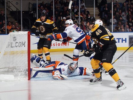 UNIONDALE, NY - NOVEMBER 19: Rick DiPietro #39 of the New York Islanders flops to the ice as Milan Lucic #17 and David Krejci #46 of the Boston Bruins look for a rebound at the Nassau Veterans Memorial Coliseum on November 19, 2011 in Uniondale, New York.  <br /><br /><span class="help">(Photo by Bruce Bennett/Getty Images)</span>