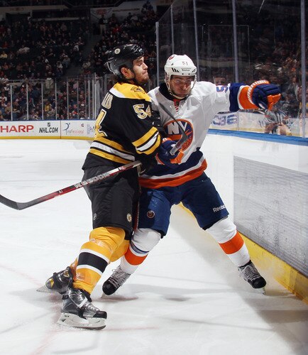 UNIONDALE, NY - NOVEMBER 19: Adam McQuaid #54 of the Boston Bruins hits Frans Nielsen #51 of the New York Islanders at the Nassau Veterans Memorial Coliseum on November 19, 2011 in Uniondale, New York. <br /><br /><span class="help">(Photo by Bruce Bennett/Getty Images)</span>