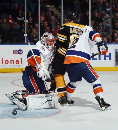 UNIONDALE, NY - NOVEMBER 19: Playing in his first NHL game, Anders Nilsson #35 of the New York Islanders deflects a shot against the Boston Bruins  at the Nassau Veterans Memorial Coliseum on November 19, 2011 in Uniondale, New York. The Bruins defeated the Islanders 6-0. <br /><br /><span class="help">(Photo by Bruce Bennett/Getty Images)</span>