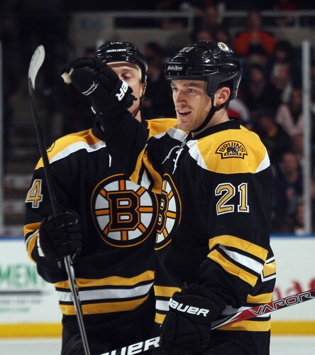 UNIONDALE, NY - NOVEMBER 19: Andrew Ference #21 of the Boston Bruins scores at 10:25 of the third period against the New York Islanders at the Nassau Veterans Memorial Coliseum on November 19, 2011 in Uniondale, New York. The Bruins defeated the Islanders 6-0. <br /><br /><span class="help">(Photo by Bruce Bennett/Getty Images)</span>