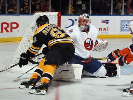 UNIONDALE, NY - NOVEMBER 19: Playing in his first NHL game, Anders Nilsson #45 of the New York Islanders blocks the net against Brad Marchand #63 of the Boston Bruins at the Nassau Veterans Memorial Coliseum on November 19, 2011 in Uniondale, New York. The Bruins defeated the Islanders 6-0.  <br /><br /><span class="help">(Photo by Bruce Bennett/Getty Images)</span>