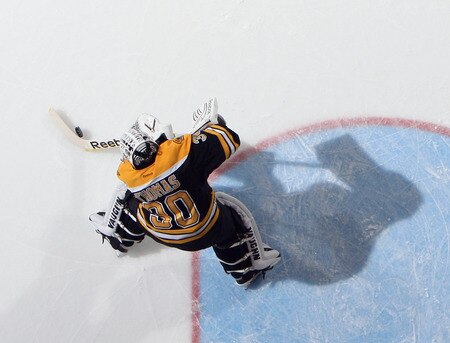 UNIONDALE, NY - NOVEMBER 19: Tim Thomas #30 of the Boston Bruins plays the puck during his 6-0 shut out against the New York Islanders at the Nassau Veterans Memorial Coliseum on November 19, 2011 in Uniondale, New York.  <br /><br /><span class="help">(Photo by Bruce Bennett/Getty Images)</span>