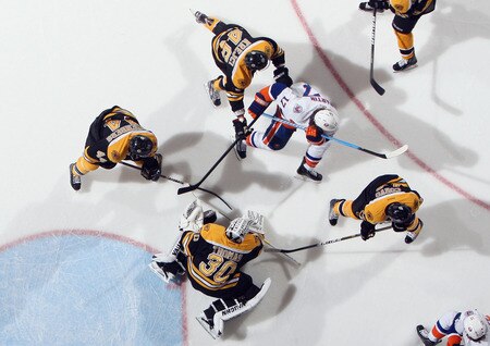 UNIONDALE, NY - NOVEMBER 19:  Tim Thomas #30 of the Boston Bruins looks for the puck during his 6-0 shut out against the New York Islanders at the Nassau Veterans Memorial Coliseum on November 19, 2011 in Uniondale, New York. The Bruins defeated the Islanders 6-0. <br /><br /><span class="help">(Photo by Bruce Bennett/Getty Images)</span>