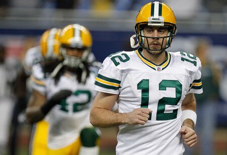 DETROIT, MI - NOVEMBER 24:  Quarterback Aaron Rodgers #12 of the Green Bay Packers warms-up in front of teammate Morgan Burnett #42 of the Packers before taking on the Detroit Lions in the Thanksgiving Day game at Ford Field on November 24, 2011 in Detroit, Michigan.  <br /><br /><span class="help">(Photo by Gregory Shamus/Getty Images)</span>