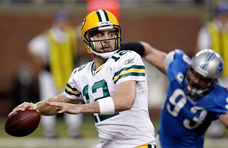 DETROIT, MI - NOVEMBER 24:  Quarterback Aaron Rodgers #12 of the Green Bay Packers looks to pass as defensive end Kyle Vanden Bosch #93 of the Detroit Lions rushes in during the first quarter of the Thanksgiving Day game at Ford Field on November 24, 2011 in Detroit, Michigan.  <br /><br /><span class="help">(Photo by Gregory Shamus/Getty Images)</span>