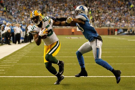 DETROIT, MI - NOVEMBER 24:  Wide receiver Greg Jennings #85 of the Green Bay Packers catches a three-yard touchdown pass against Brandon McDonald #33 of the Detroit Lions in the second quarter during the Thanksgiving Day game at Ford Field on November 24, 2011 in Detroit, Michigan.  <br /><br /><span class="help">(Photo by Gregory Shamus/Getty Images)</span>