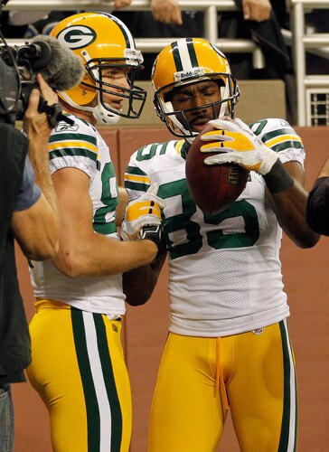 DETROIT, MI - NOVEMBER 24:  Wide receiver Greg Jennings #85 of the Green Bay Packers celebrates his three-yard touchdown catch with Jordy Nelson #87 against the Detroit Lions in the second quarter during the Thanksgiving Day game at Ford Field on November 24, 2011 in Detroit, Michigan.  <br /><br /><span class="help">(Photo by Gregory Shamus/Getty Images)</span>