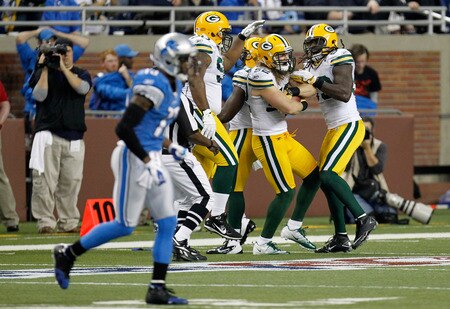 DETROIT, MI - NOVEMBER 24:   Clay Matthews #52 of the Green Bay Packers celebrates an interception off a tipped-ball thrown by quarterback  Matthew Stafford #9 of the Detroit Lions in the second quarter with his teammates after Matthews returns it seven-yards in the Thanksgiving Day game at Ford Field on November 24, 2011 in Detroit, Michigan.  <br /><br /><span class="help">(Photo by Gregory Shamus/Getty Images)</span>