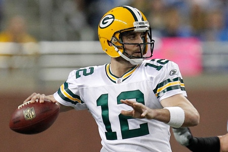 DETROIT, MI - NOVEMBER 24:  Quarterback Aaron Rodgers #12 of the Green Bay Packers looks to pass against the Detroit Lions in the first half of the Thanksgiving Day game at Ford Field on November 24, 2011 in Detroit, Michigan.  <br /><br /><span class="help">(Photo by Gregory Shamus/Getty Images)</span>