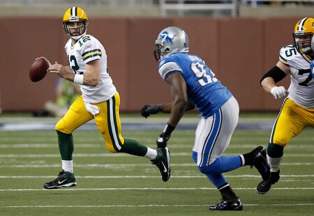 DETROIT, MI - NOVEMBER 24:  Quarterback Aaron Rodgers #12 of the Green Bay Packers looks to pass against the Detroit Lions in the first half of the Thanksgiving Day game at Ford Field on November 24, 2011 in Detroit, Michigan.  <br /><br /><span class="help">(Photo by Gregory Shamus/Getty Images)</span>