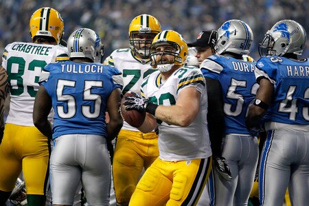 DETROIT, MI - NOVEMBER 24:  Running back John Kuhn #30 of the Green Bay Packers celebrates his one-yard touchdown run in the third quarter against the Detroit Lions during the Thanksgiving Day game at Ford Field on November 24, 2011 in Detroit, Michigan.  <br /><br /><span class="help">(Photo by Gregory Shamus/Getty Images)</span>
