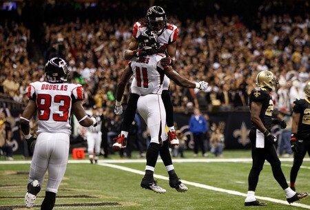 NEW ORLEANS, LA - DECEMBER 26:  Wide receiver Julio Jones #11 of the Atlanta Falcons celebrates his 21-yard first quarter touchdown catch with teammate wide receiver Roddy White #84 against the New Orleans Saints at the Mercedes-Benz Superdome on December 26, 2011 in New Orleans, Louisiana.  <br /><br /><span class="help">(Photo by Chris Graythen/Getty Images)</span>