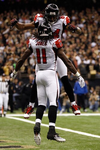 NEW ORLEANS, LA - DECEMBER 26:  Wide receiver Julio Jones #11 of the Atlanta Falcons celebrates his 21-yard first quarter touchdown catch with teammate wide receiver Roddy White #84 against the New Orleans Saints at the Mercedes-Benz Superdome on December 26, 2011 in New Orleans, Louisiana.  <br /><br /><span class="help">(Photo by Chris Graythen/Getty Images)</span>