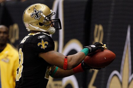 NEW ORLEANS, LA - DECEMBER 26:  Running back Pierre Thomas #23 of the New Orleans Saints heads towards the seats as he put a bow and attaches it to the football after scoring on a four-yard touchdown run against the Atlanta Falcons at the Mercedes-Benz Superdome on December 26, 2011 in New Orleans, Louisiana.  <br /><br /><span class="help">(Photo by Chris Graythen/Getty Images)</span>